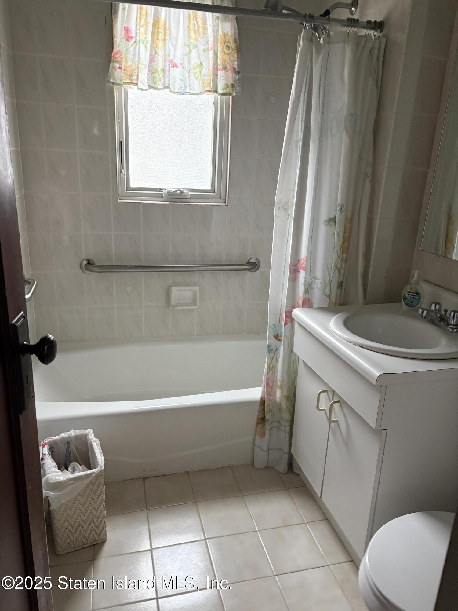 9105 Ridge Boulevard Brooklyn, NY 11209 - Photo 8 of 12 a bathroom with a sink toilet and bathtub