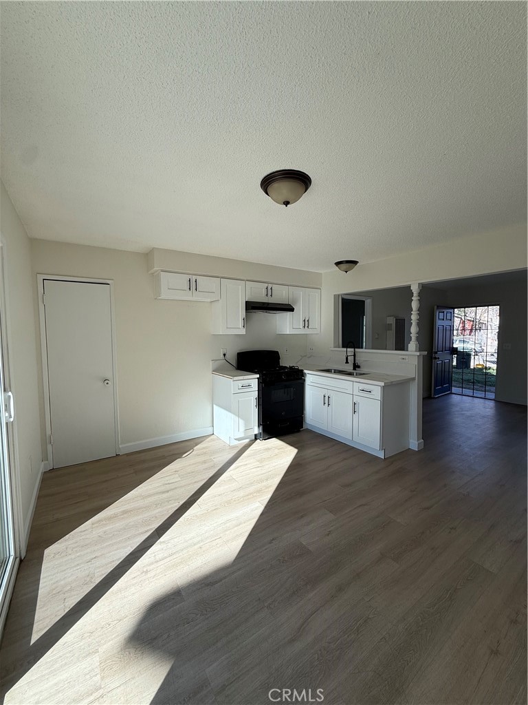 558 South Benjamin Street Rialto, CA 92376 - Photo 15 of 25 a large white kitchen with a stove top oven
