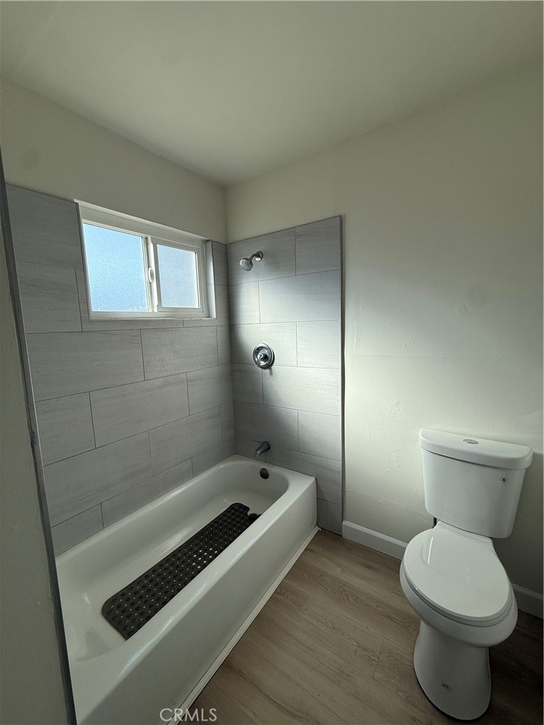 558 South Benjamin Street Rialto, CA 92376 - Photo 23 of 25 a bathroom with a toilet and a sink