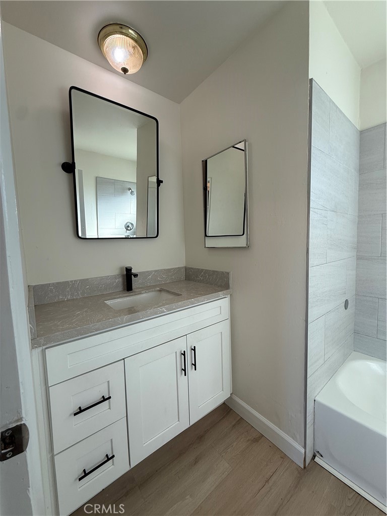 558 South Benjamin Street Rialto, CA 92376 - Photo 24 of 25 a bathroom with a toilet sink and mirror