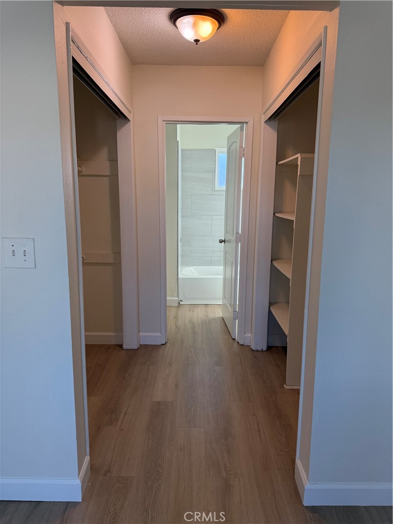 558 South Benjamin Street Rialto, CA 92376 - Photo 25 of 25 an empty room with wooden floor and closet