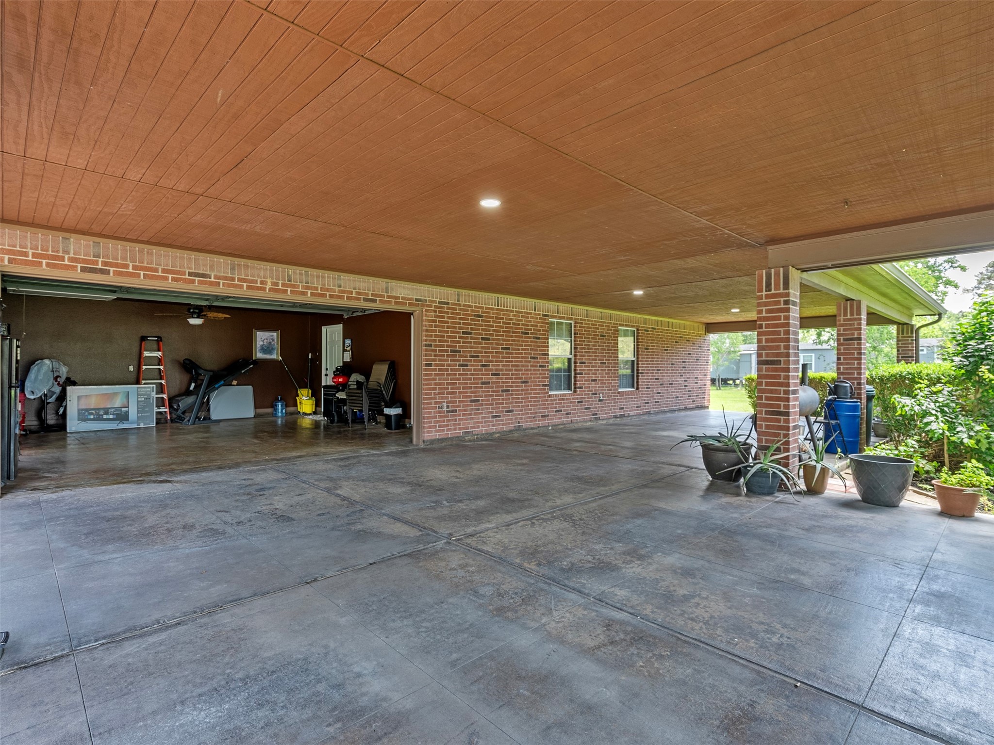 21007 Cook Road Tomball, TX 77377 - Photo 12 of 31 a view of a porch with chairs and backyard