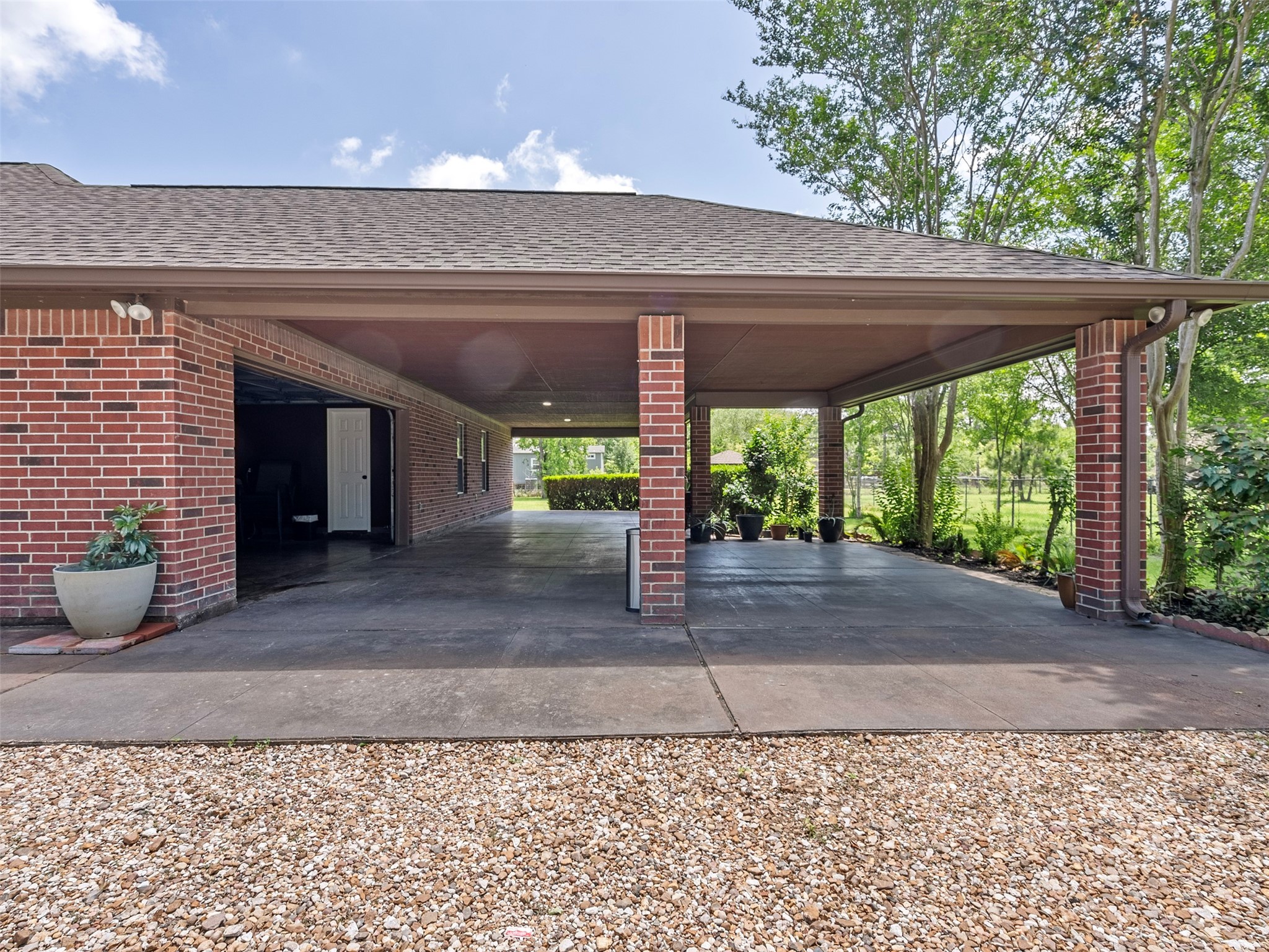 21007 Cook Road Tomball, TX 77377 - Photo 13 of 31 a view of a patio with a table and chairs under an umbrella