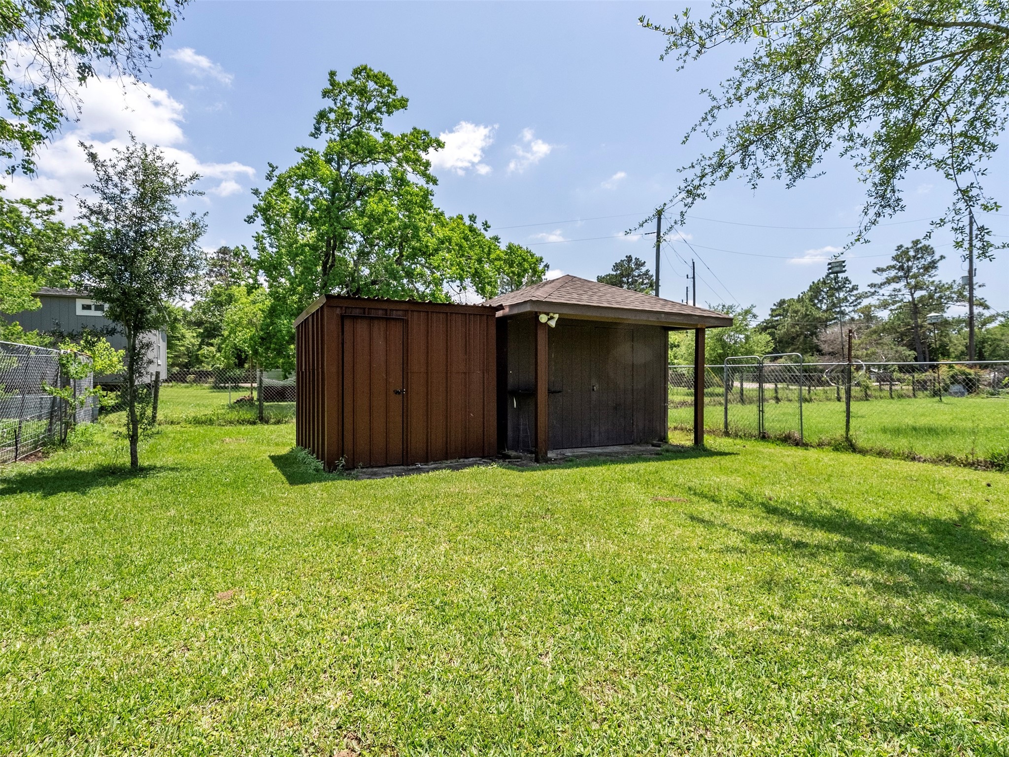 21007 Cook Road Tomball, TX 77377 - Photo 15 of 31 a yard with some trees in the background