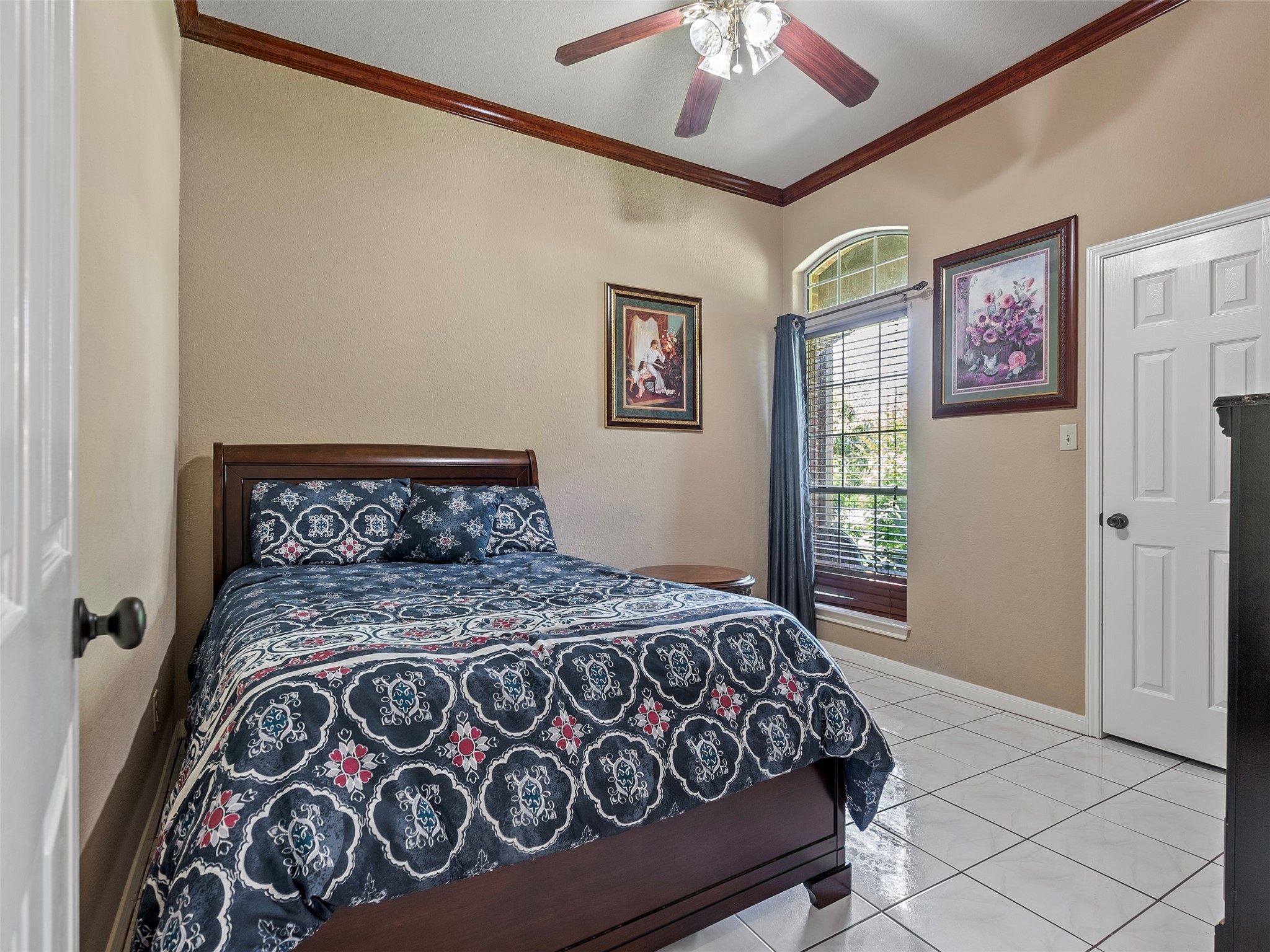 21007 Cook Road Tomball, TX 77377 - Photo 20 of 31 a bed sitting in a bedroom next to a window