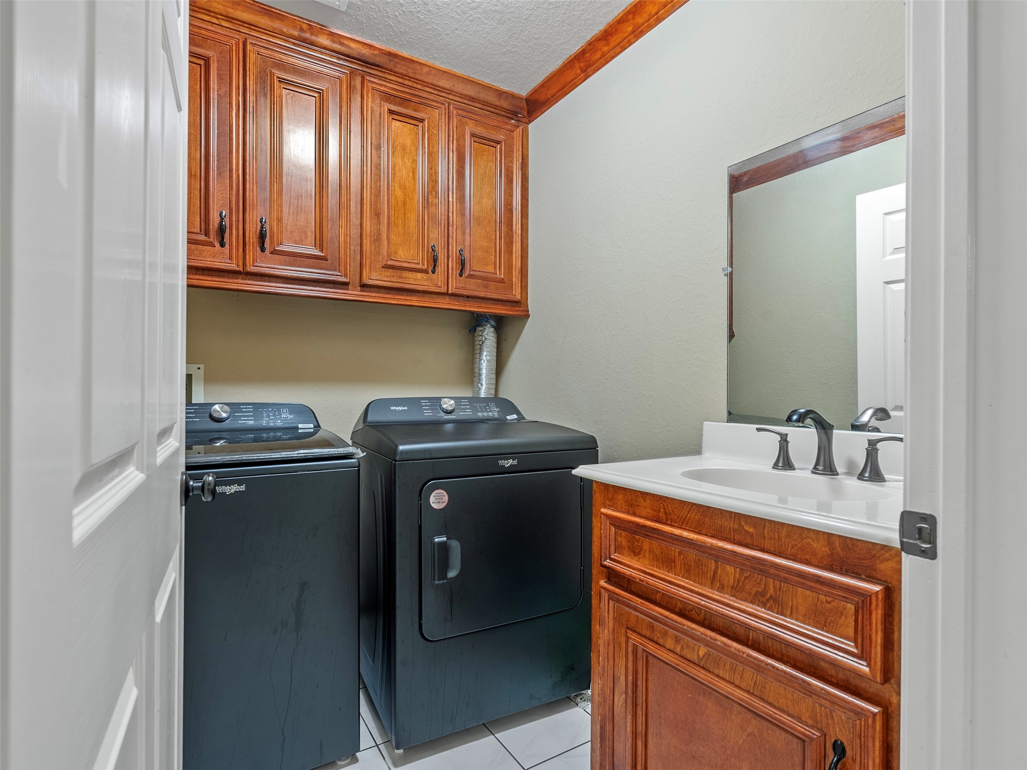 21007 Cook Road Tomball, TX 77377 - Photo 21 of 31 a room with storage and utility