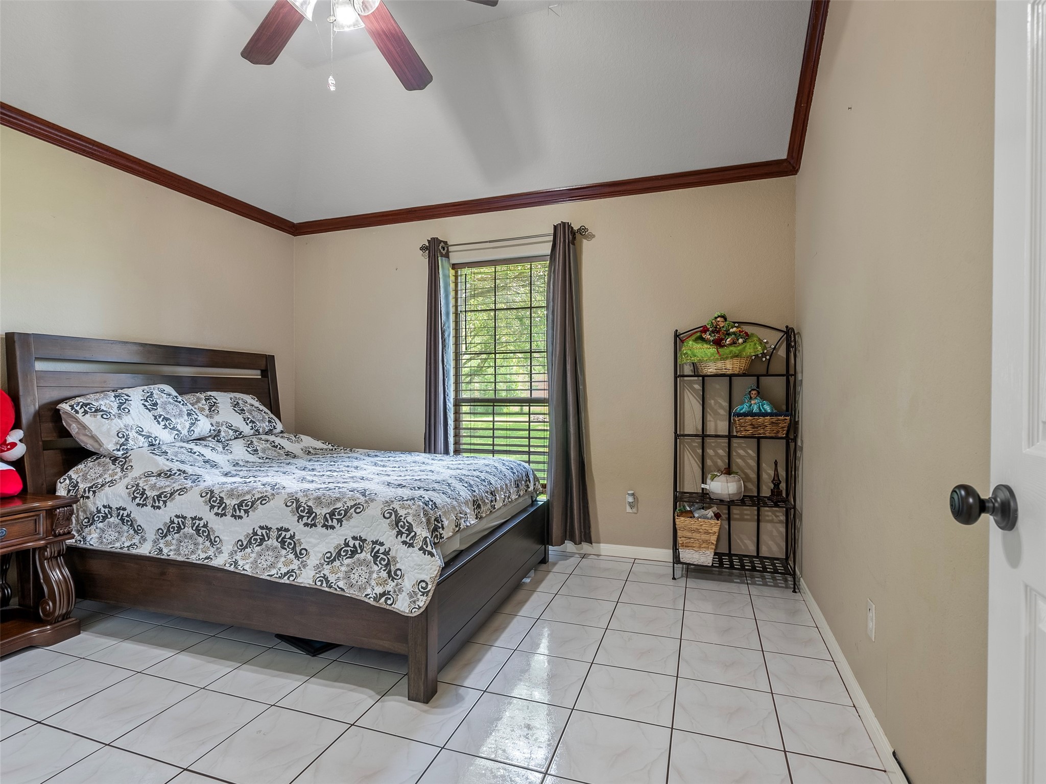 21007 Cook Road Tomball, TX 77377 - Photo 22 of 31 a bedroom with a bed and a window