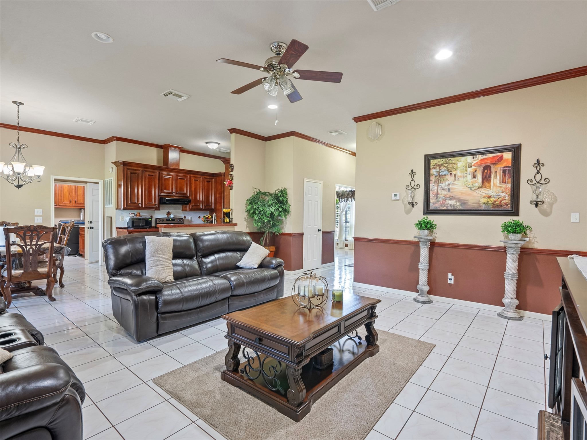 21007 Cook Road Tomball, TX 77377 - Photo 25 of 31 a living room with furniture and a flat screen tv