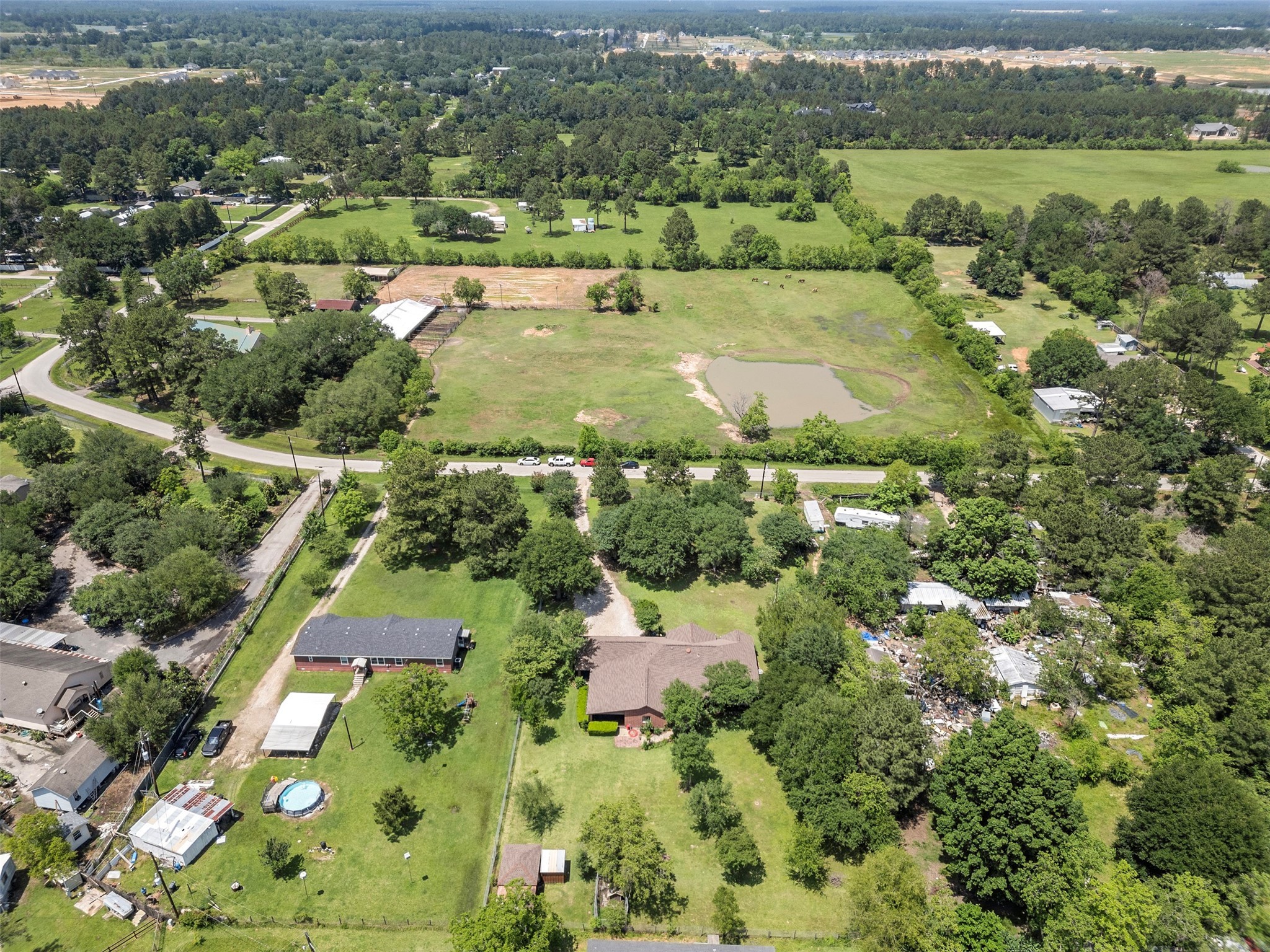 21007 Cook Road Tomball, TX 77377 - Photo 3 of 31 an aerial view of residential houses with outdoor space and trees