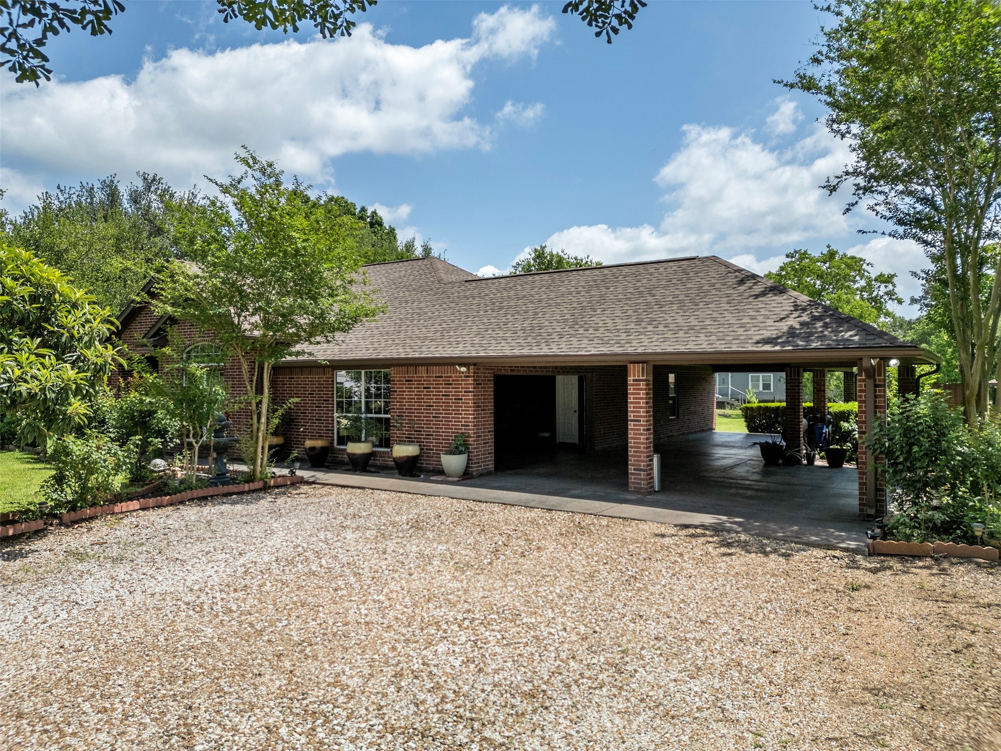 21007 Cook Road Tomball, TX 77377 - Photo 5 of 31 a front view of a house with a yard and a garage