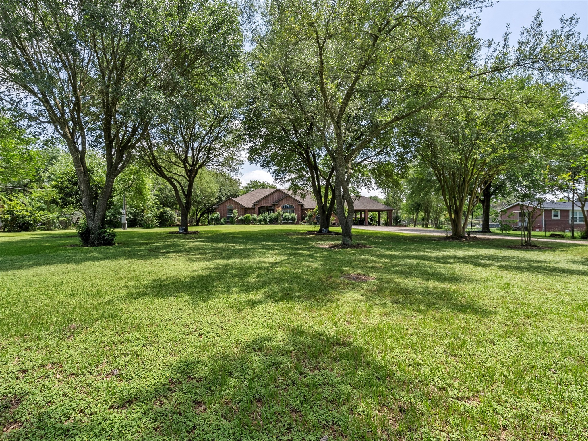 21007 Cook Road Tomball, TX 77377 - Photo 10 of 31 a view of a grassy field with trees