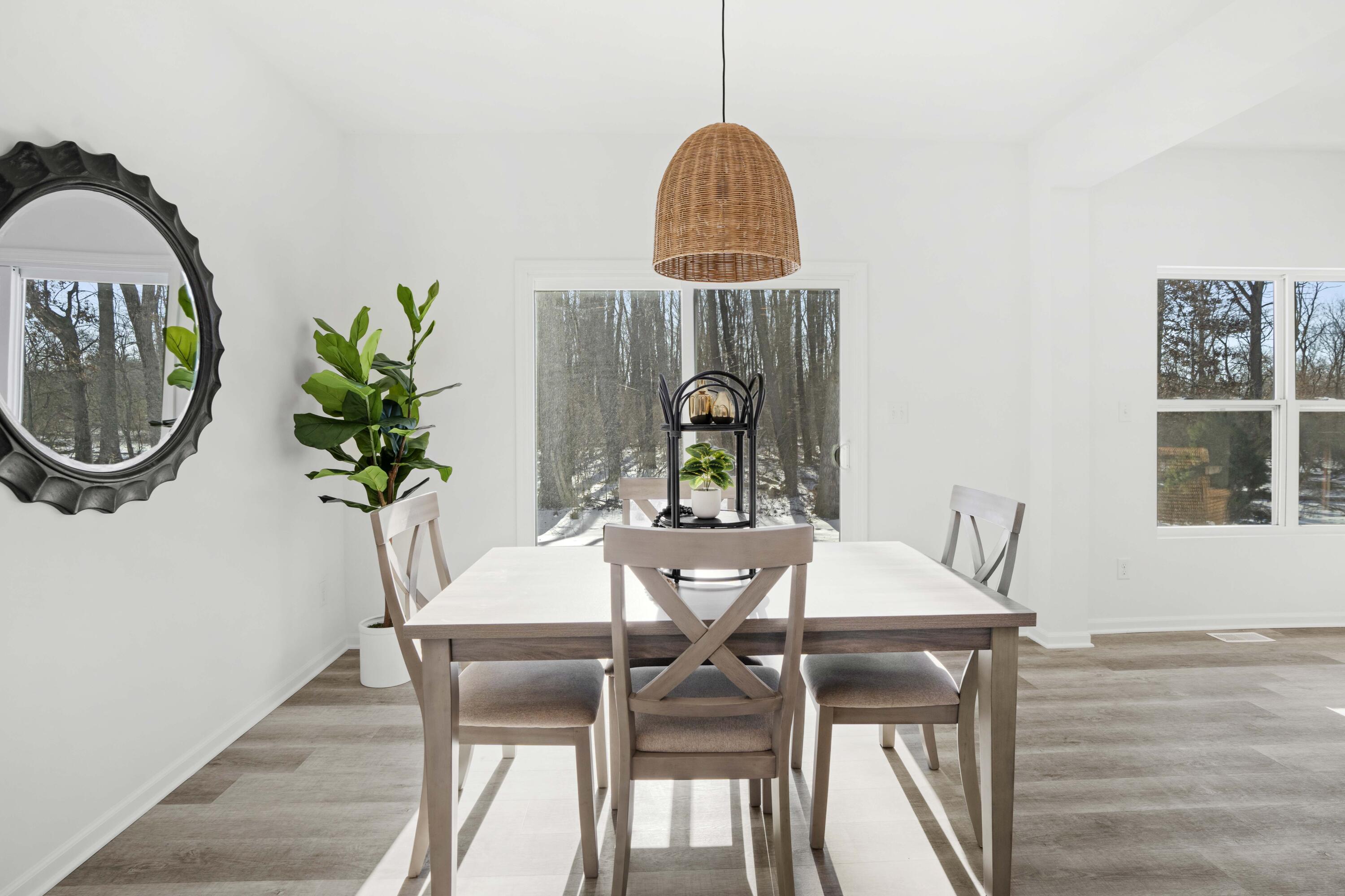 10390 California Street Crown Point, IN 46307 - Photo 12 of 26 a view of a dining room with furniture and wooden floor