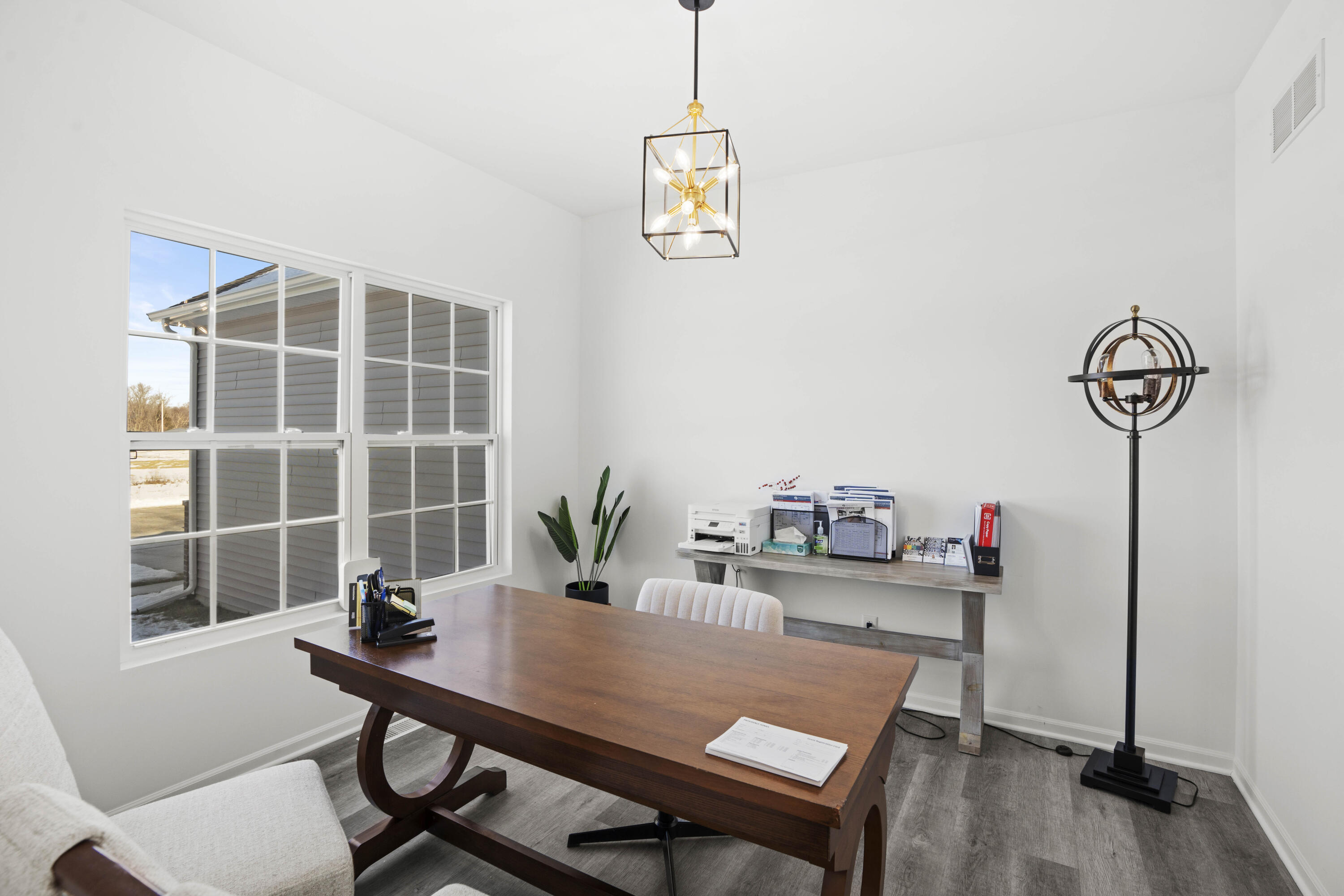 10390 California Street Crown Point, IN 46307 - Photo 16 of 26 a view of a workspace with furniture