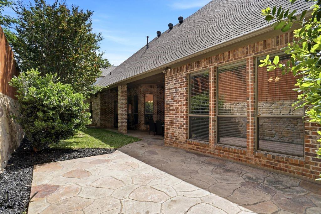 620 Highview Lane Hurst, TX 76054 - Photo 39 of 40 a view of backyard with potted plants and a large tree