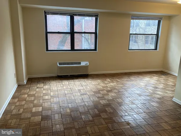 a view of an empty room with a window