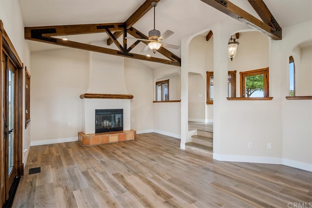 5920 Iron Gate Road Creston, CA 93432 - Photo 16 of 57 a view of a livingroom with wooden floor and a fireplace