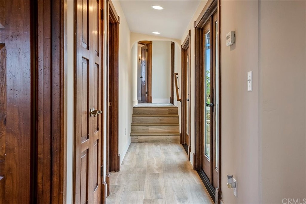 5920 Iron Gate Road Creston, CA 93432 - Photo 18 of 57 a view of a hallway with wooden floor and staircase