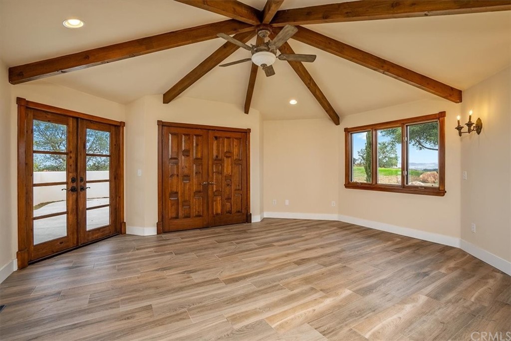 5920 Iron Gate Road Creston, CA 93432 - Photo 20 of 57 a view of an empty room with window and wooden floor