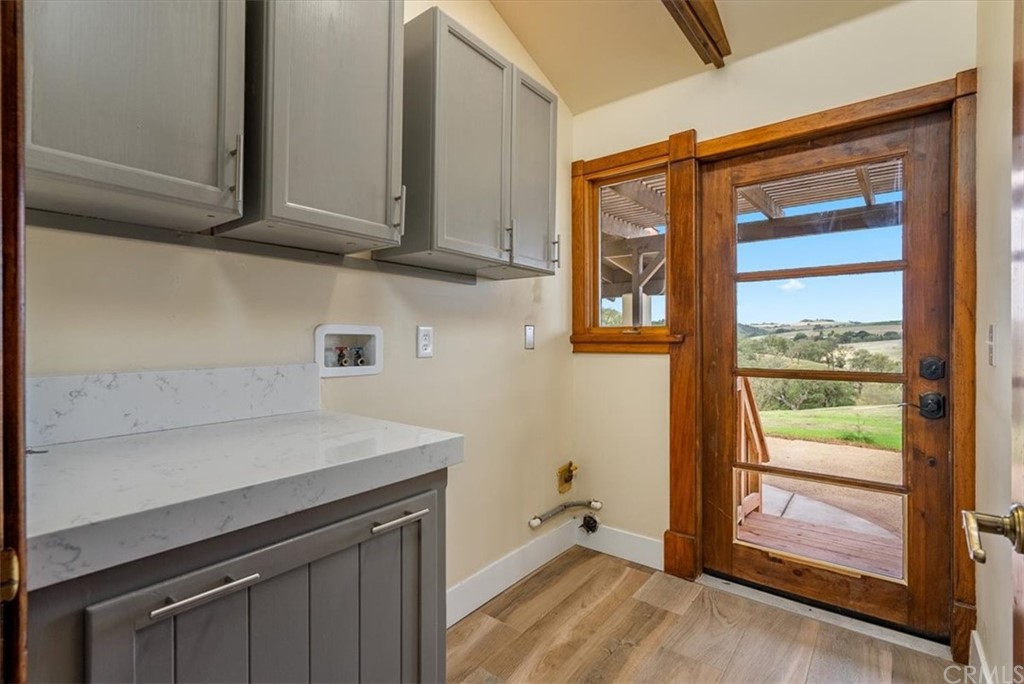 5920 Iron Gate Road Creston, CA 93432 - Photo 26 of 57 a view of a kitchen with wooden floor and cabinets