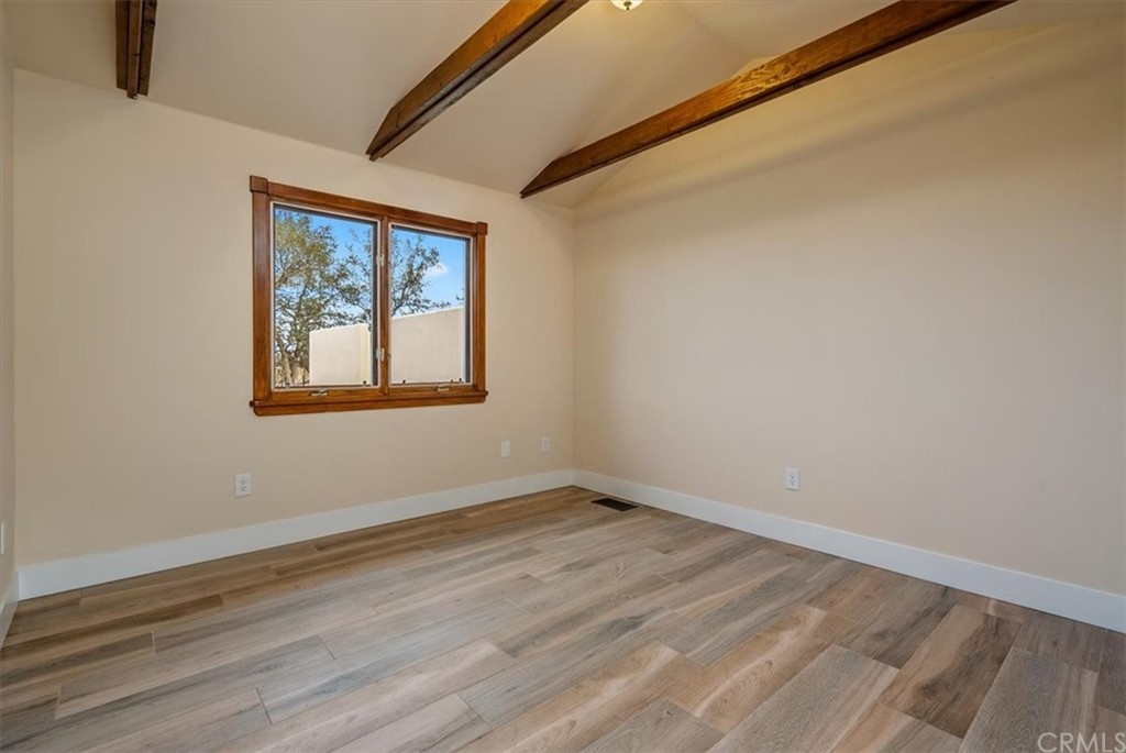 5920 Iron Gate Road Creston, CA 93432 - Photo 29 of 57 a view of an empty room with wooden floor and a window