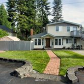a front view of a house with garden