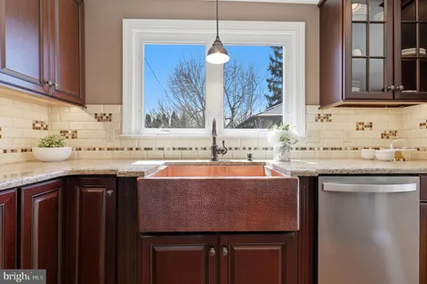a kitchen with a sink and a window