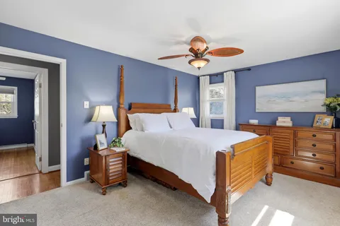 a bed room with a bed and a chandelier