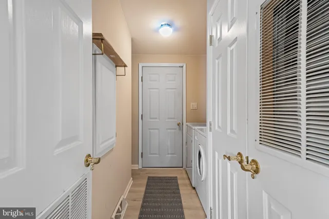 a bathroom with a sink toilet and shower curtain