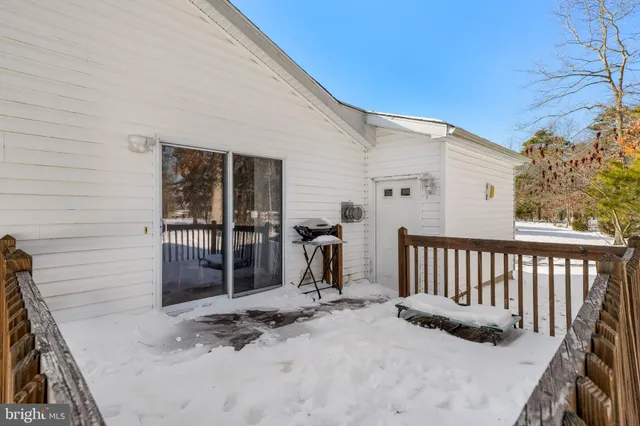 a view of a house with a wooden deck