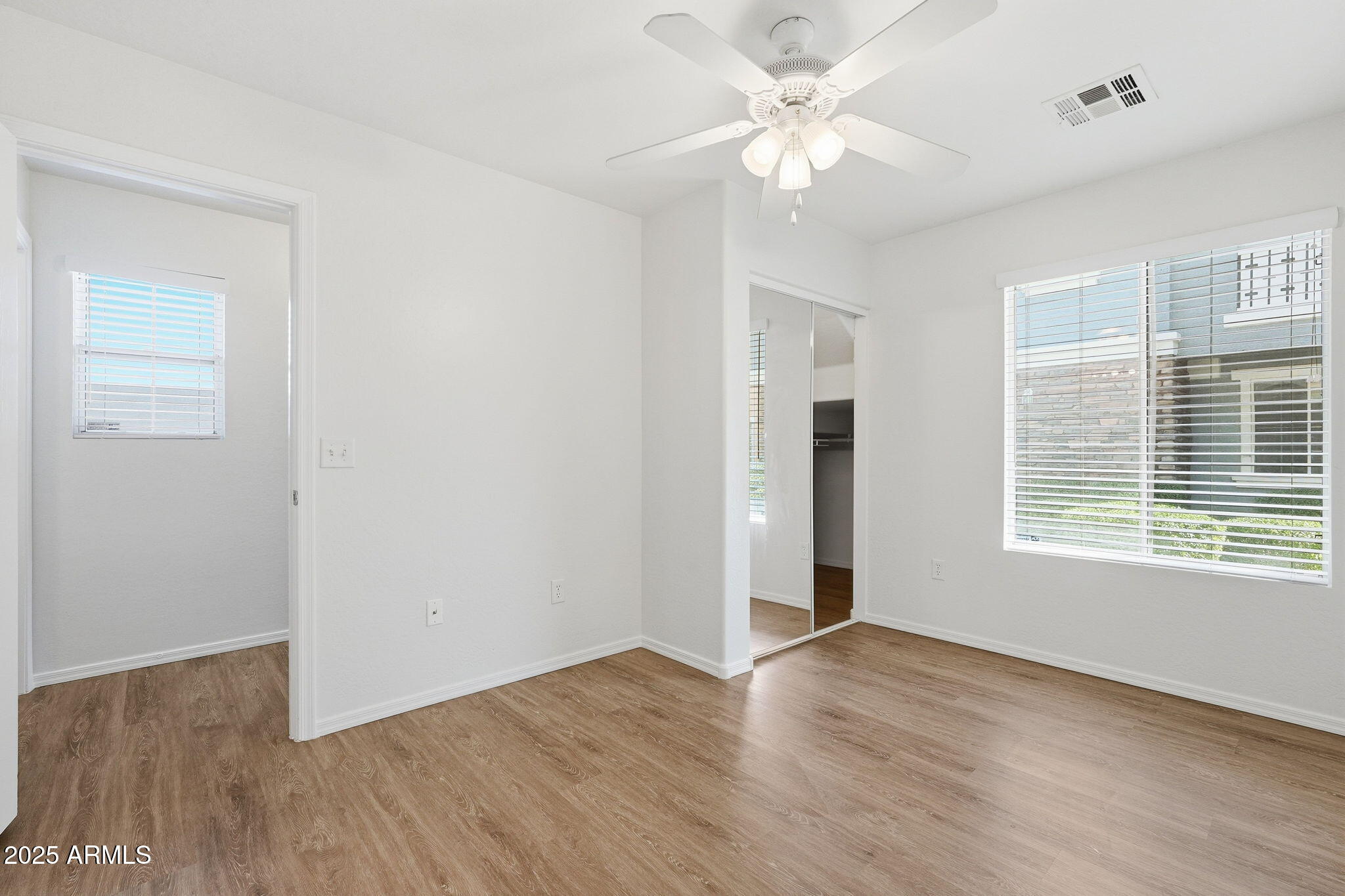 9233 East Neville Avenue, Unit 1136 Mesa, AZ 85209 - Photo 15 of 29 wooden floor in an empty room with a window