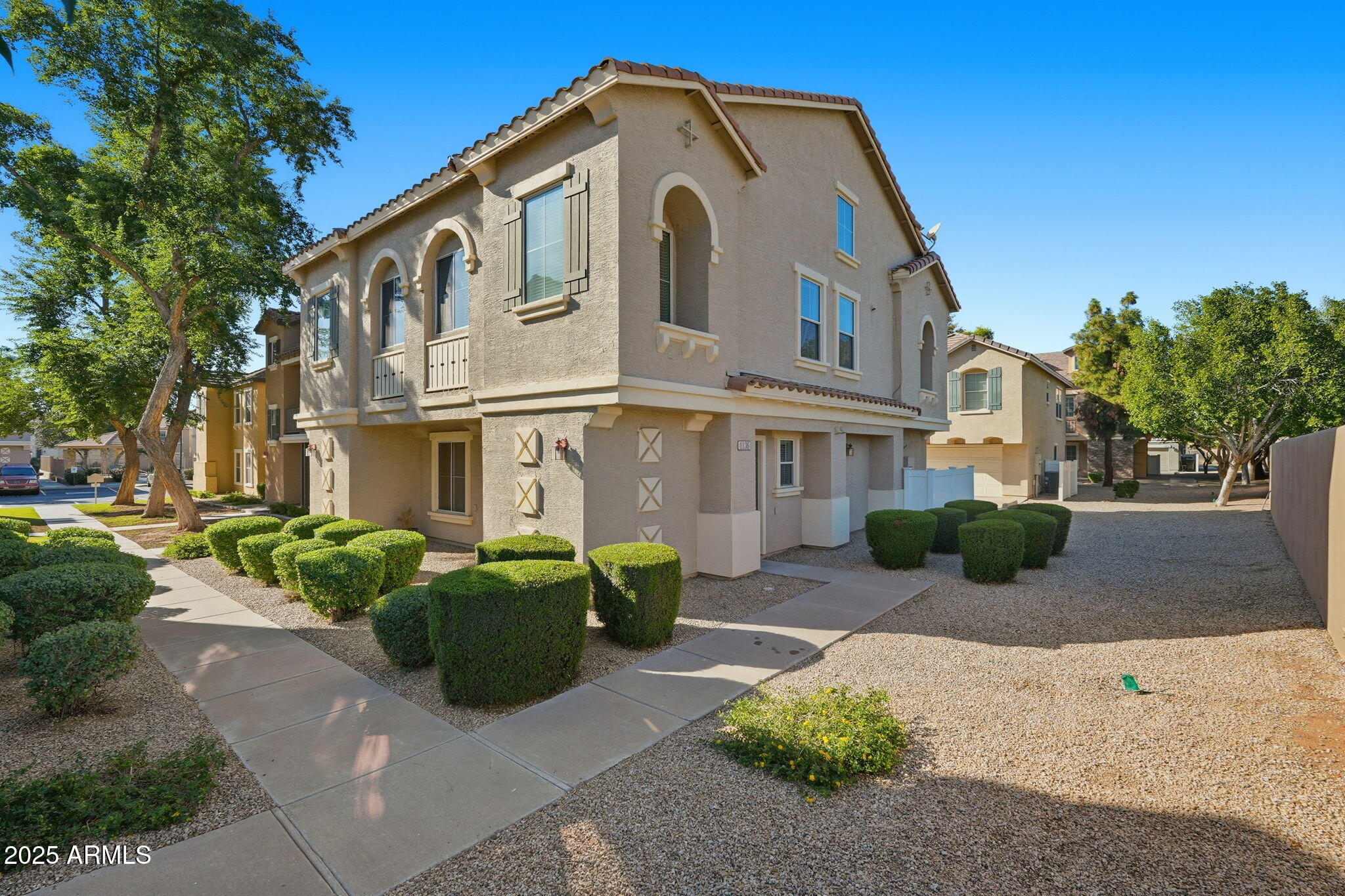 9233 East Neville Avenue, Unit 1136 Mesa, AZ 85209 - Photo 2 of 29 a front view of a house with garden