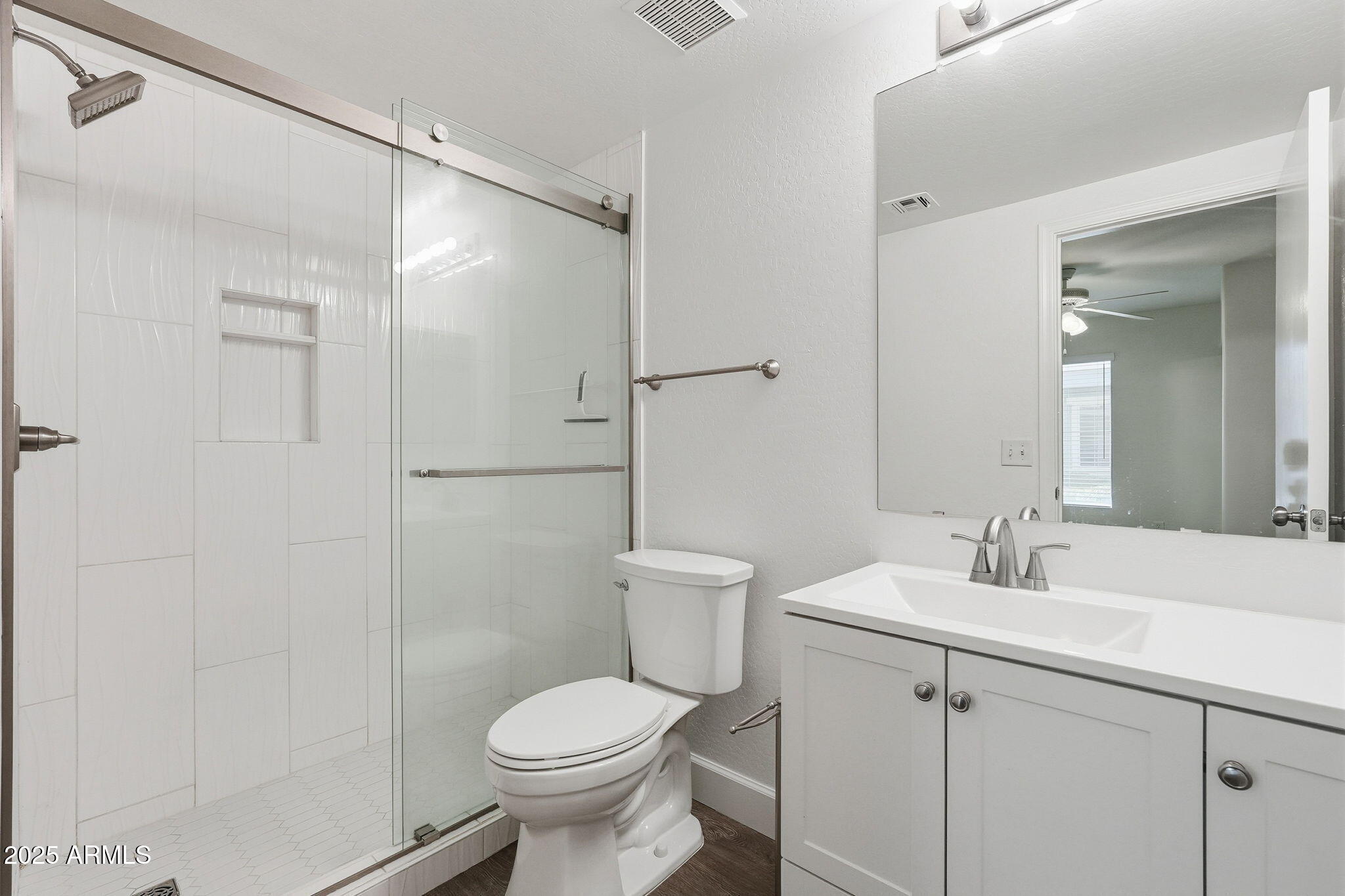 9233 East Neville Avenue, Unit 1136 Mesa, AZ 85209 - Photo 21 of 29 a bathroom with a sink toilet and shower