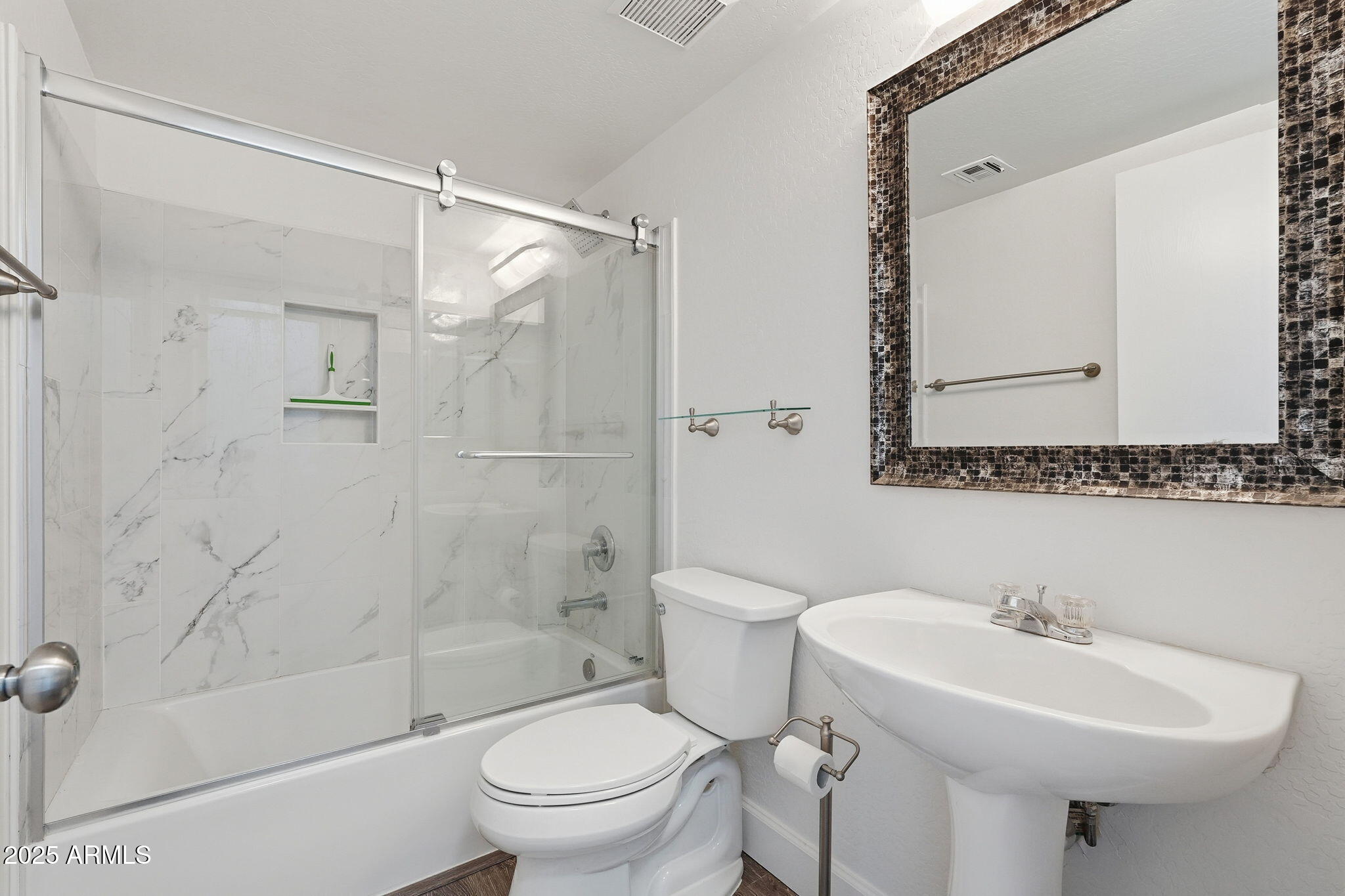 9233 East Neville Avenue, Unit 1136 Mesa, AZ 85209 - Photo 24 of 29 a bathroom with a sink toilet and shower