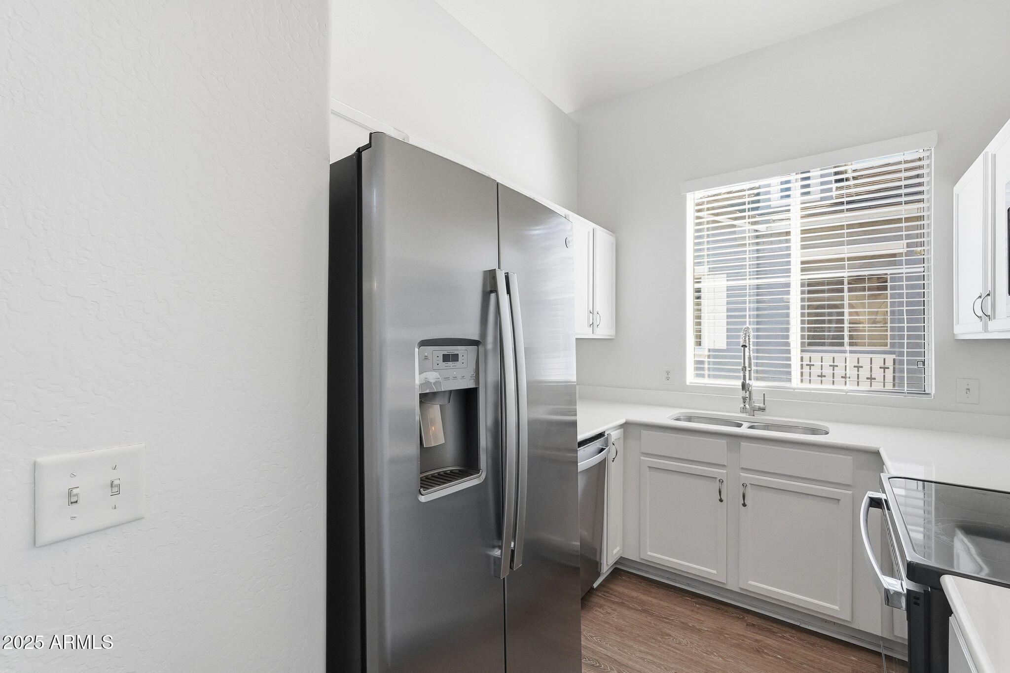 9233 East Neville Avenue, Unit 1136 Mesa, AZ 85209 - Photo 7 of 29 a kitchen with a refrigerator sink and windows