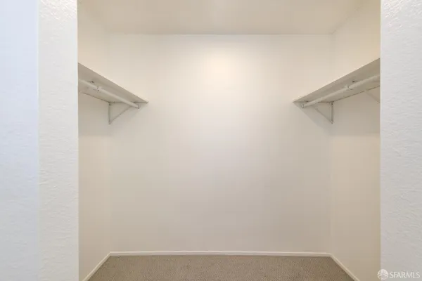 a balcony with wooden floor and fence