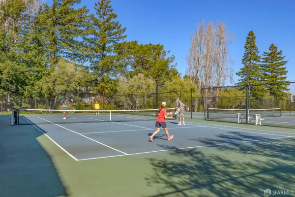 a view of a chair and table in backyard