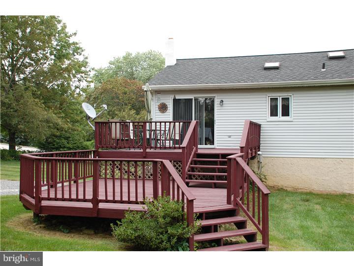 185 Old Spring Road Coatesville, PA 19320 - Photo 12 of 16 a view of a house with backyard and deck