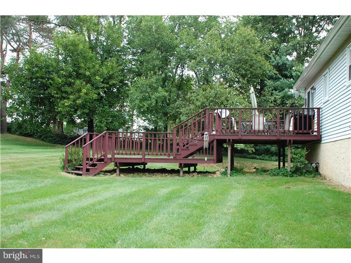 185 Old Spring Road Coatesville, PA 19320 - Photo 13 of 16 a view of a house with a backyard and deck