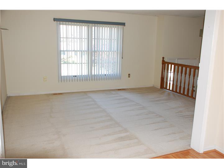 185 Old Spring Road Coatesville, PA 19320 - Photo 4 of 16 a view of an empty room with a window