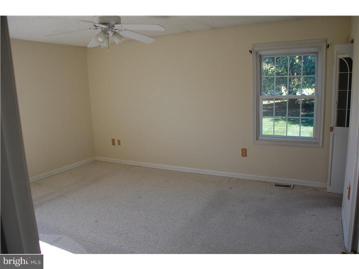 185 Old Spring Road Coatesville, PA 19320 - Photo 6 of 16 a view of an empty room and window