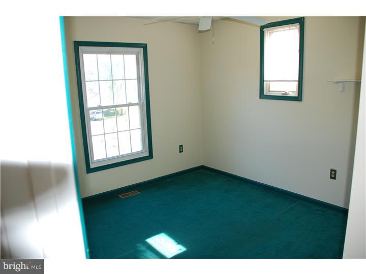 185 Old Spring Road Coatesville, PA 19320 - Photo 7 of 16 a view of an empty room with a window