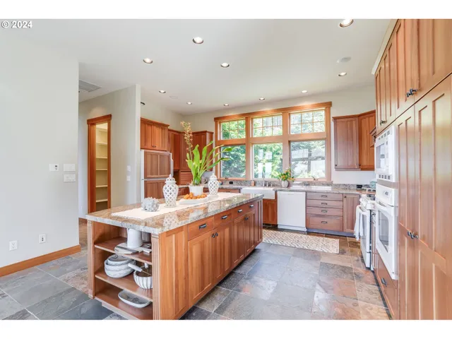 a kitchen with sink cabinets and wooden floor