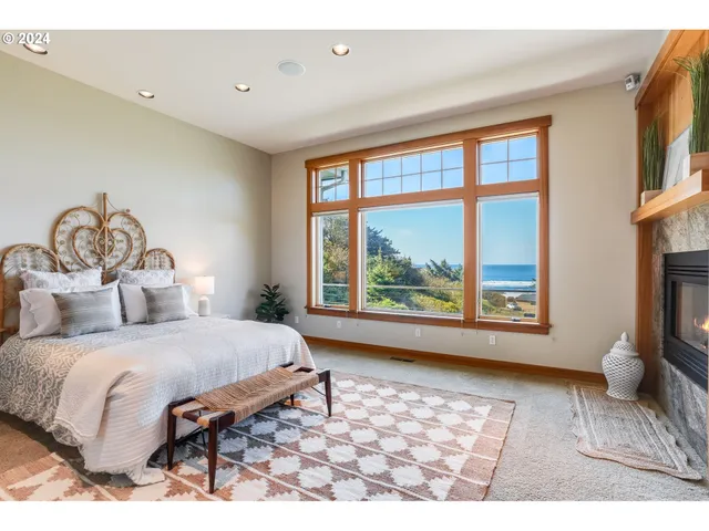 a bedroom with a large bed and a large window