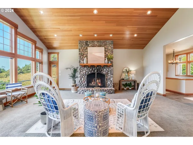 a dining room with furniture garden view and a large window