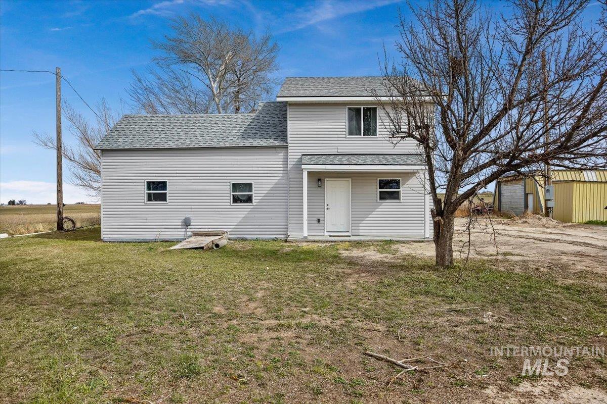 3536 North 2300 E Road Filer, ID 83328 - Photo 1 of 47 Rear view of house with roof with shingles and a yard