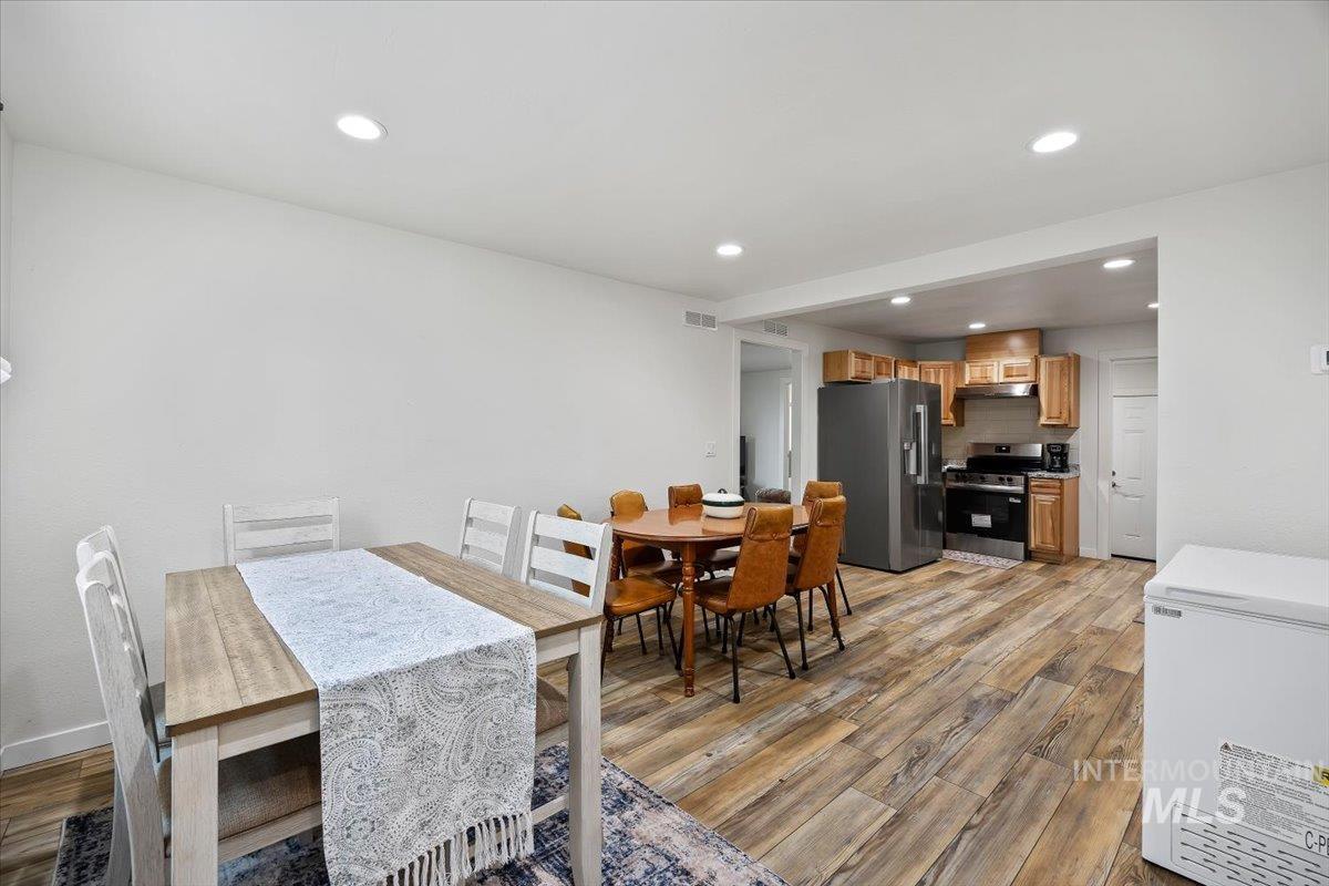 3536 North 2300 E Road Filer, ID 83328 - Photo 12 of 47 Dining area featuring light wood finished floors and recessed lighting