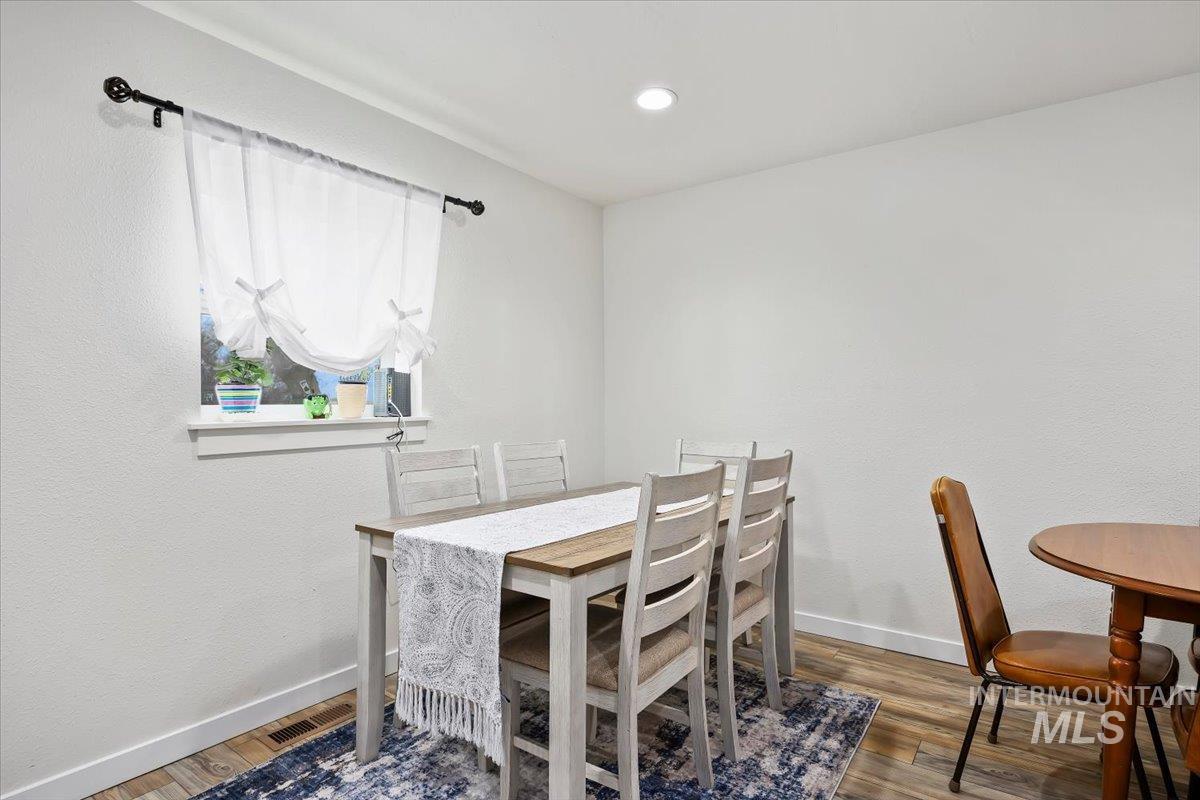 3536 North 2300 E Road Filer, ID 83328 - Photo 13 of 47 Dining area featuring wood finished floors and recessed lighting
