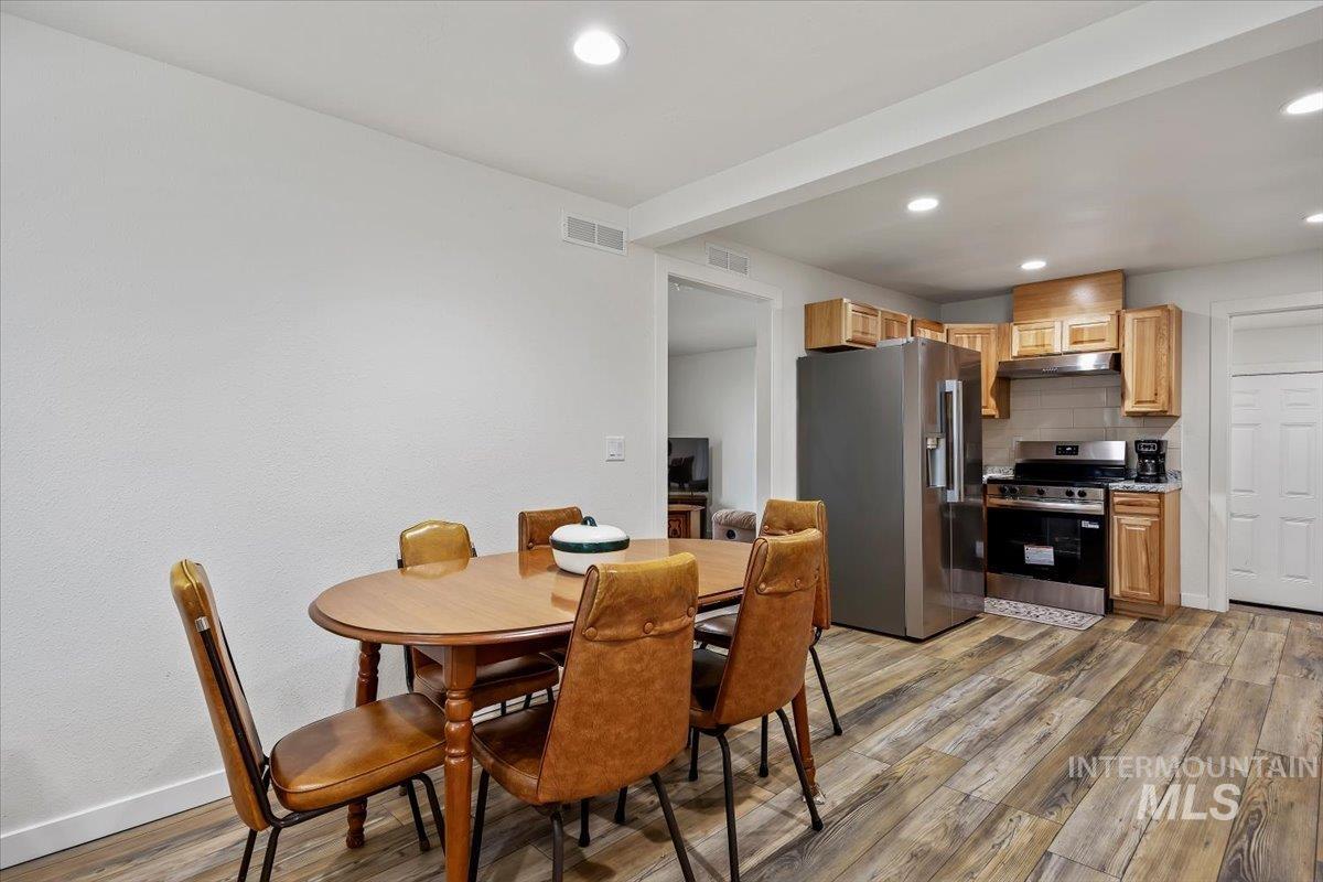 3536 North 2300 E Road Filer, ID 83328 - Photo 14 of 47 Dining room featuring light wood-type flooring and recessed lighting