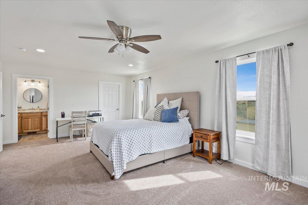 3536 North 2300 E Road Filer, ID 83328 - Photo 18 of 47 Bedroom featuring light carpet, a ceiling fan, recessed lighting, and ensuite bathroom