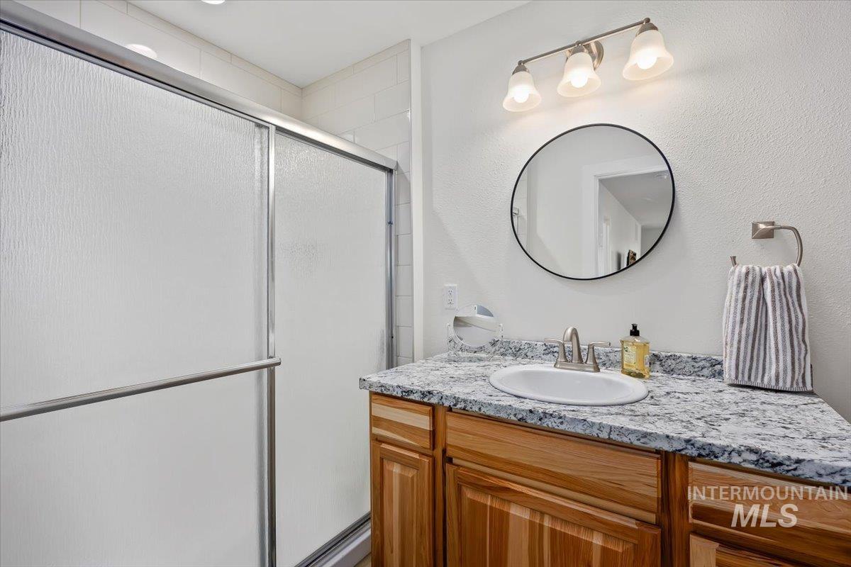 3536 North 2300 E Road Filer, ID 83328 - Photo 19 of 47 Full bathroom featuring vanity and a stall shower